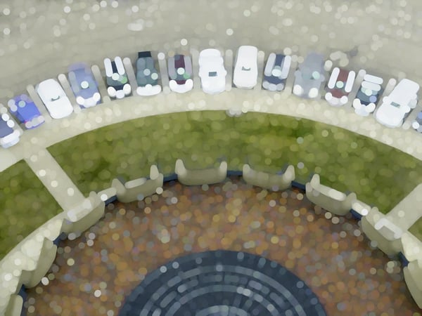 Abstract of cars parked neatly in an arc by forecourt with grass and tile, for themes of attraction, tourism, order